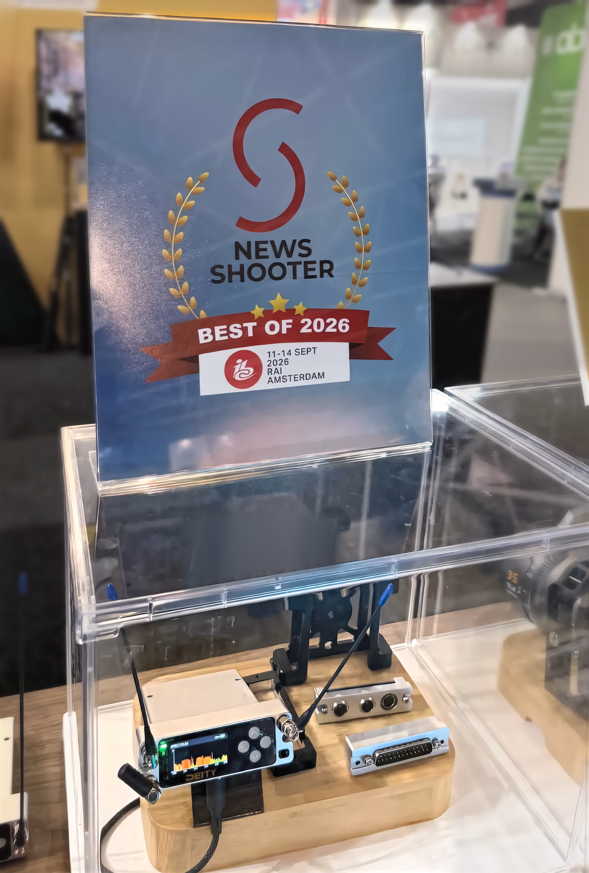 The Newsshooter Best of 2026 award card on the Deity stand at IBC 2026, above a D4RX in a display case
