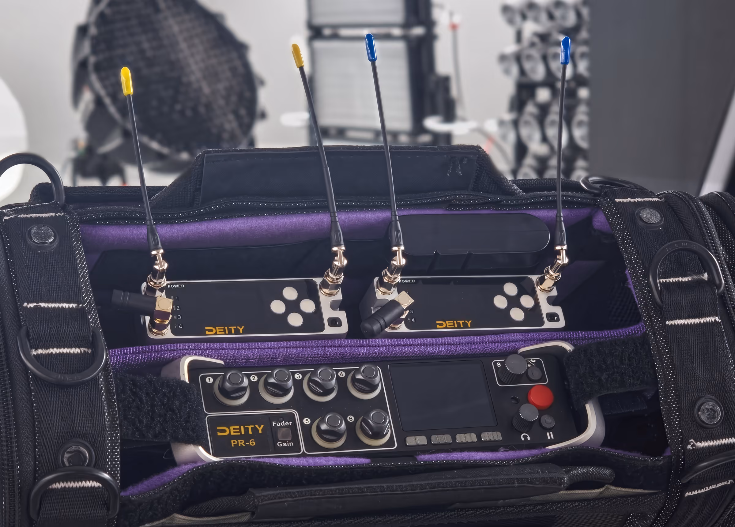 A sound bag with a Deity recorder and two D4RX receivers slotted in on top, antennas up