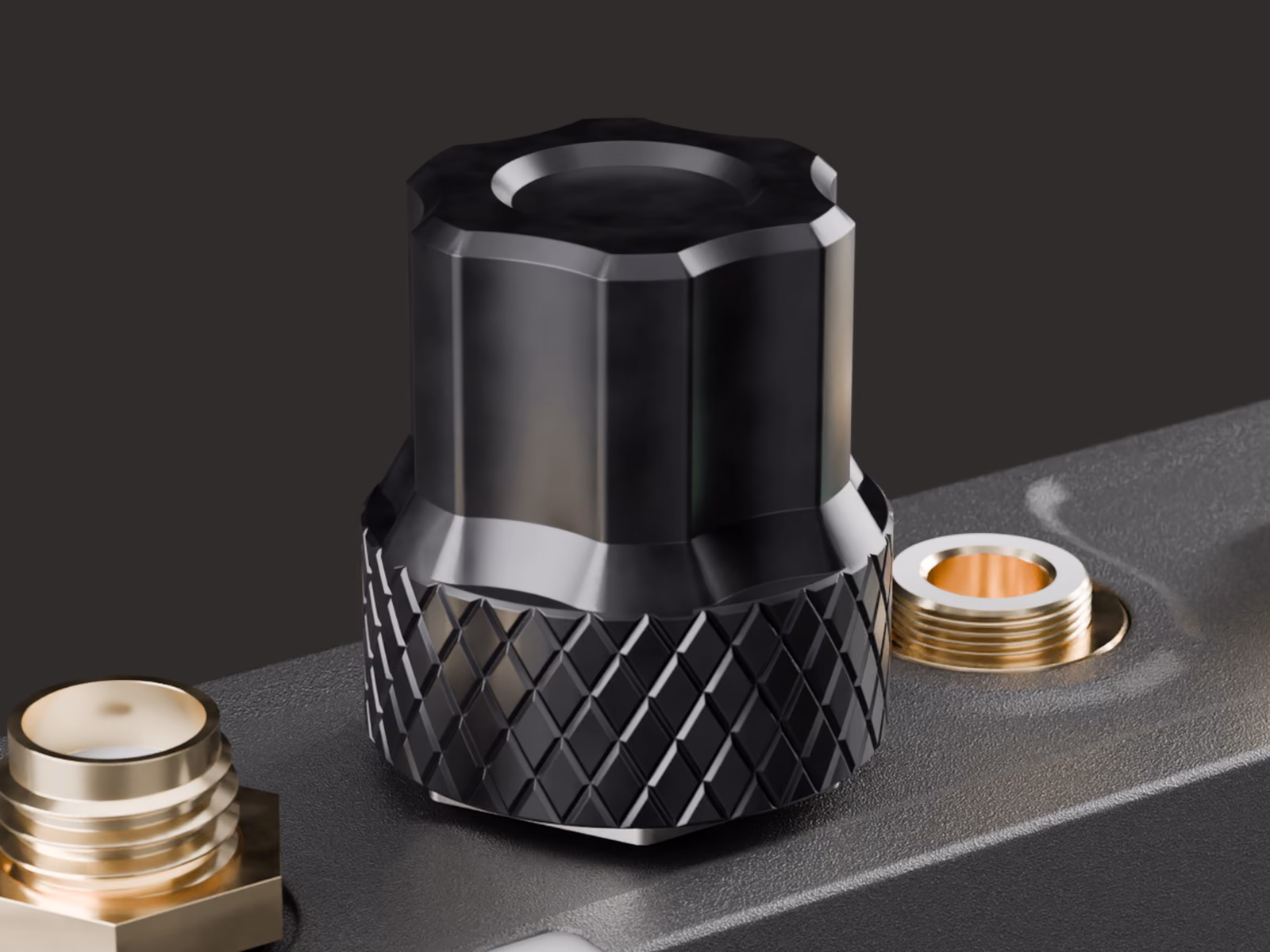 Close-up of the knurled metal headphone knob on top of the DIFB