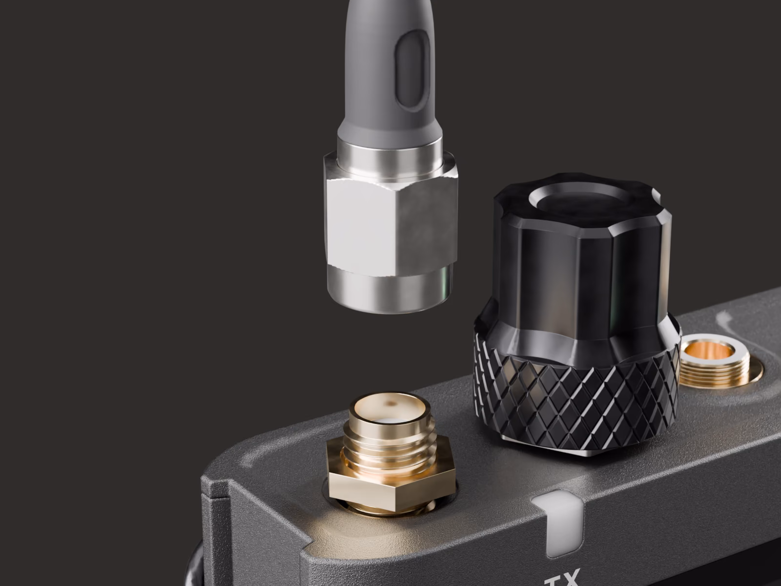 The top of the DIFB: two gold SMA antenna ports, the metal knob and the locking 3.5 mm headphone jack