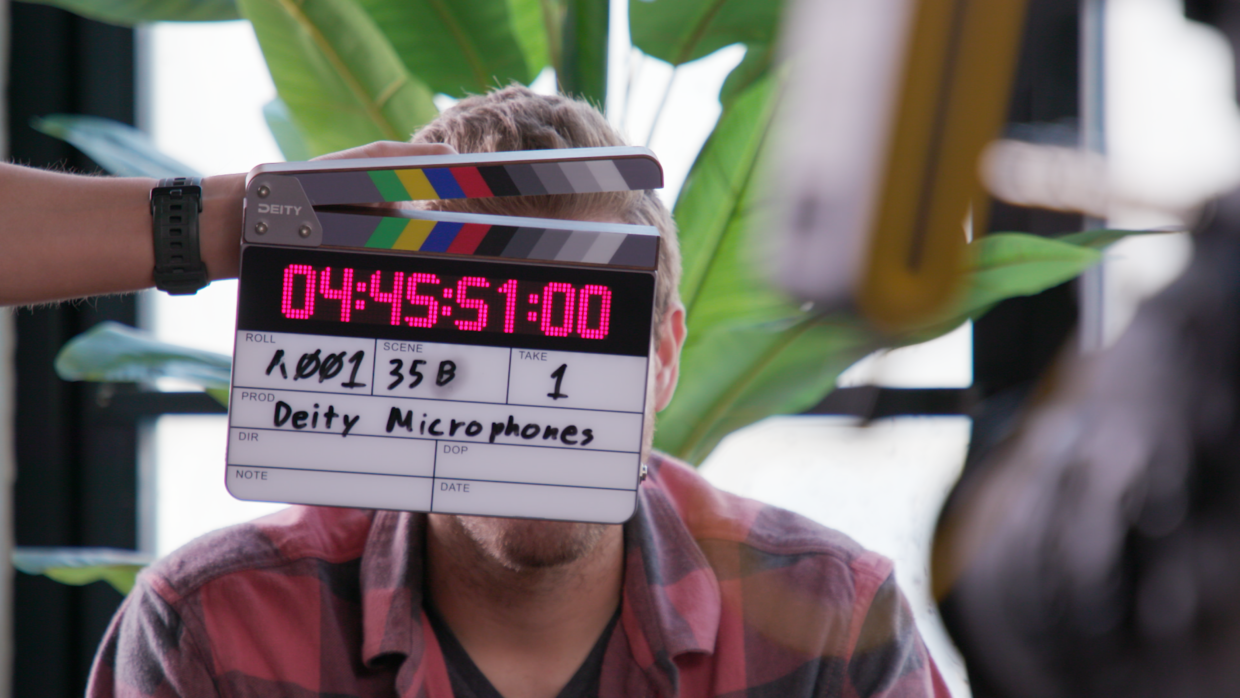 Deity TC-SL1 timecode slate. 2nd AC marking a take using soft sticks