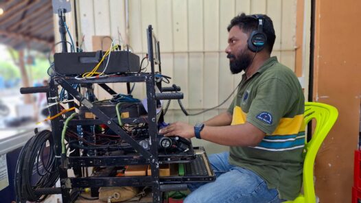 Tony Badu MPSE operating a sound cart on the set of a professional TV commercial